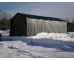 portable garage anchored tightly with two machines inside of them